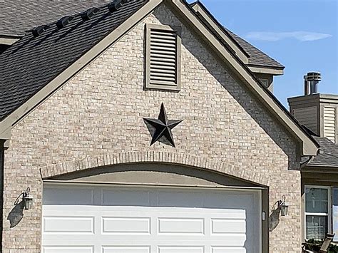 what is the meaning of the metal stars on houses|big metal star on house.